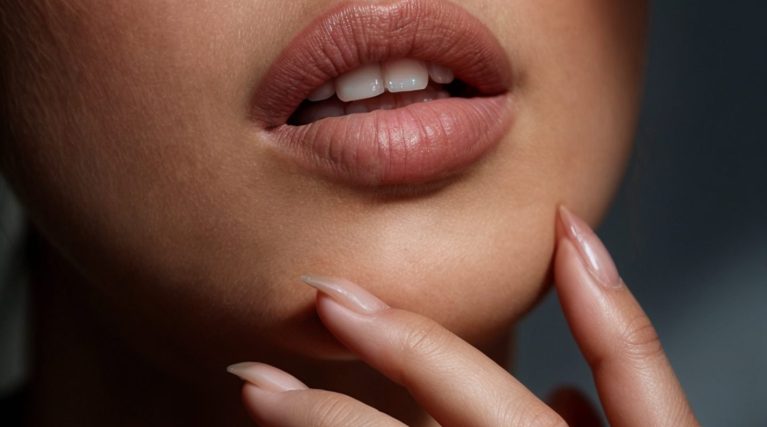 closeup-shot-focusing-lower-part-woman-face-her-hand-is-placed-neatly-her-chin (1) closeup-shot-focusing-lower-part-woman-face-her-hand-is-placed-neatly-her-chin (1)