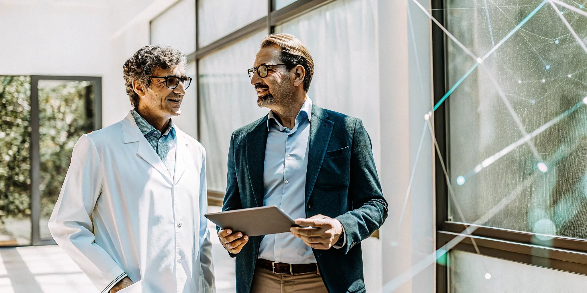 A doctor explains the benefits of testosterone therapy to a man using a tablet.