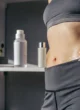 how-to-fade-stretch-marks-after-weight-loss-654780 Visible stretch marks on a woman's stomach after weight loss.