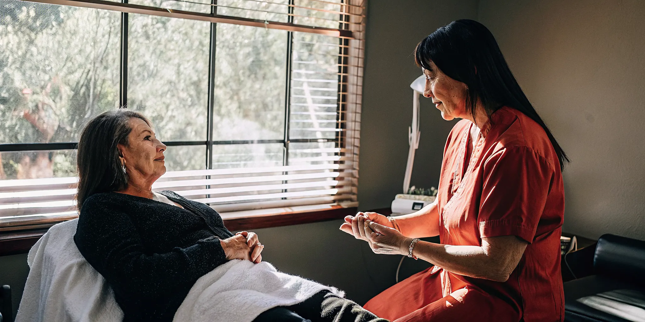 Patient discussing a DiamondGlow facial consultation with an aesthetic provider in Tampa
