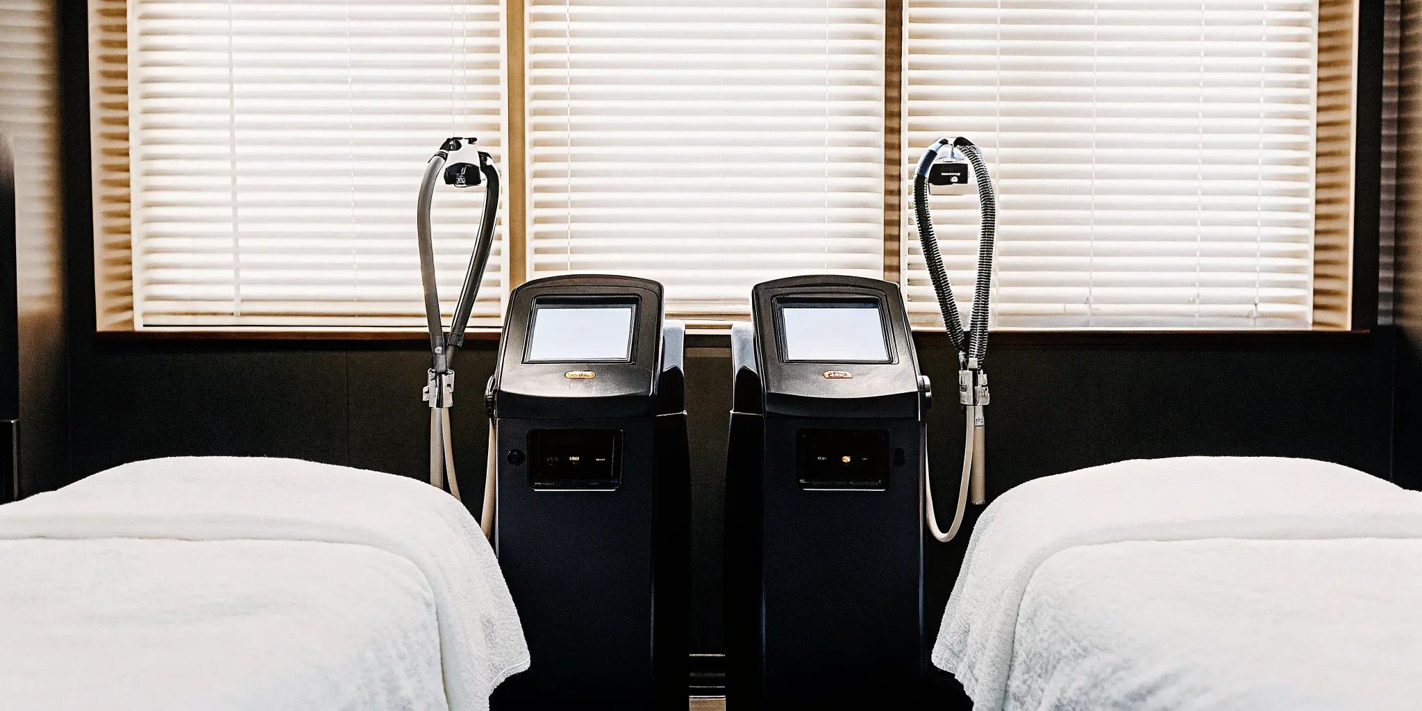 Medical spa treatment room with advanced laser body contouring equipment in a modern Tampa clinic