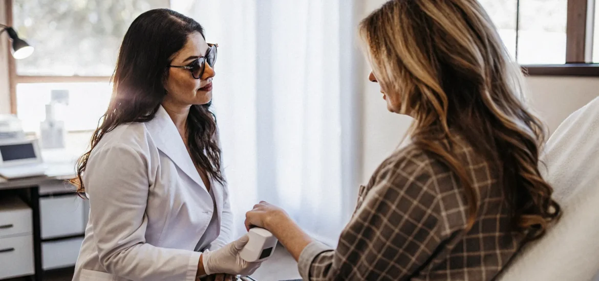 laser-tattoo-removal-tampa-consultation-aftercare Patient discussing laser tattoo removal with a clinical provider
