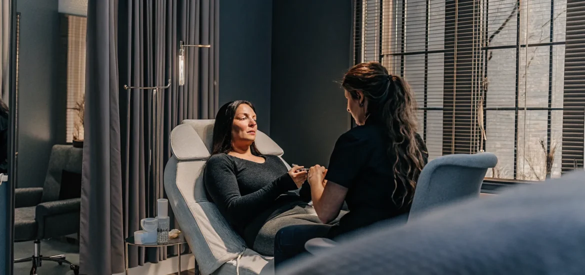 Patient discussing natural-looking lip filler goals with a clinical provider in Tampa