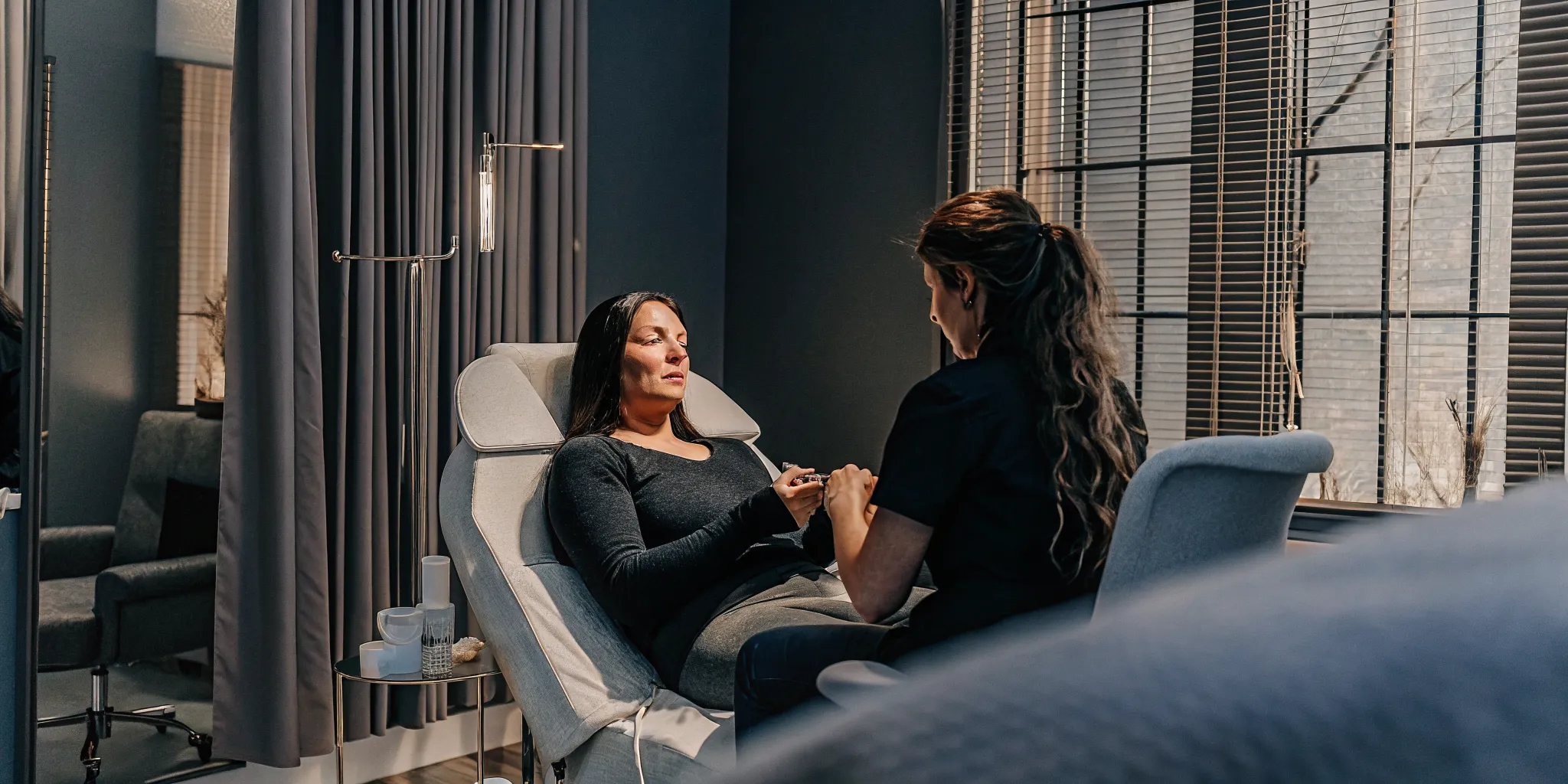 Patient discussing natural-looking lip filler goals with a clinical provider in Tampa